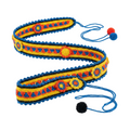 A handcrafted crochet belt coiled on a white background, featuring a bright yellow base, red and blue geometric patterns, decorative floral medallions, a blue scalloped edge, and string ties ending in red, blue, and black pom-poms.