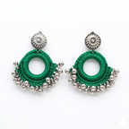 Handcrafted green thread crochet hoop earrings featuring silver-toned beads and ornate sunflower-style studs on a white background.