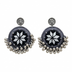 Pair of handcrafted grey silk thread circular earrings featuring star-shaped mirror work and silver metallic ghungroo beads on a white background.