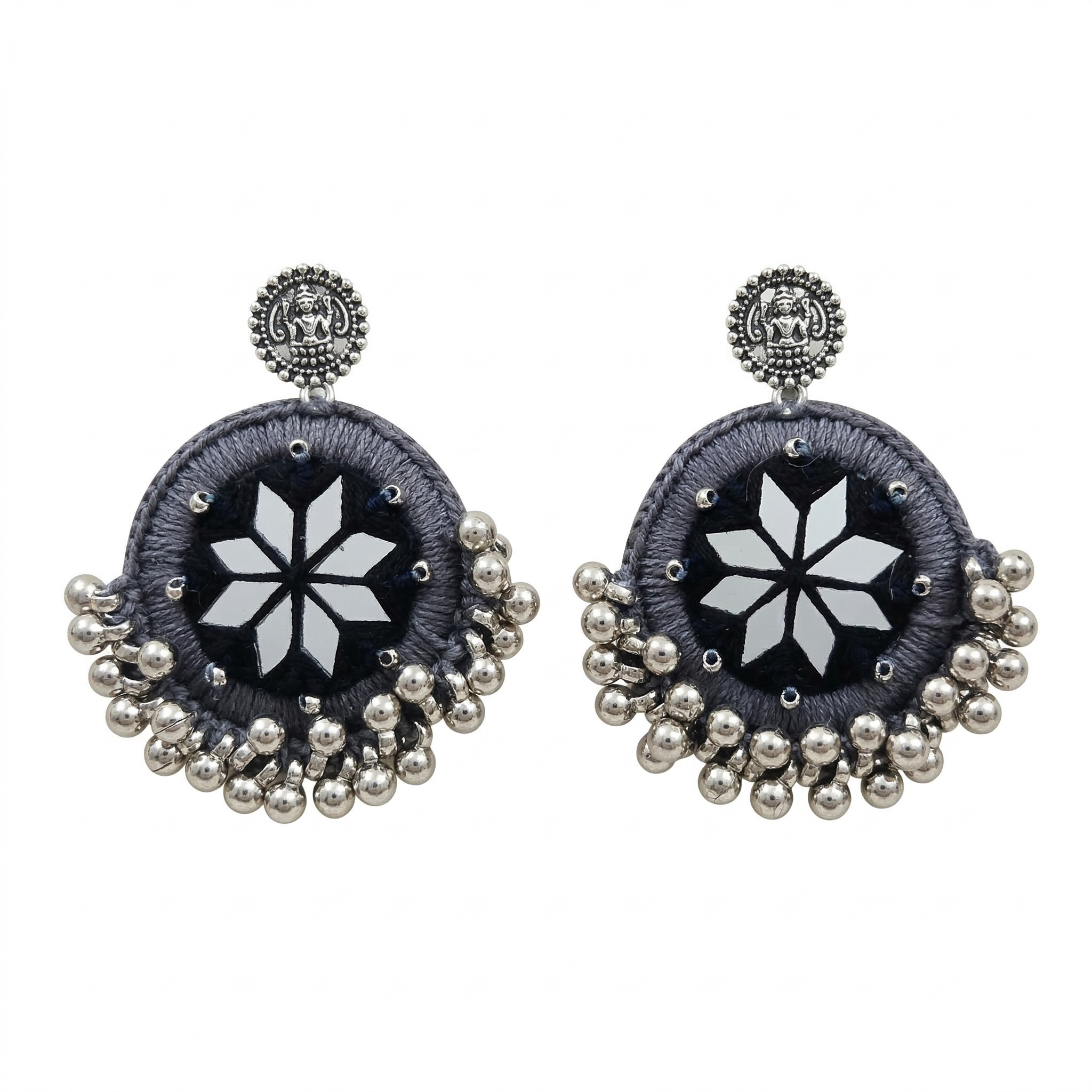 Pair of handcrafted grey silk thread circular earrings featuring star-shaped mirror work and silver metallic ghungroo beads on a white background.