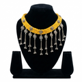 Yellow braided thread choker necklace on a black display stand featuring silver oxidised floral charms and metallic bead fringe.