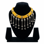 Yellow braided thread choker necklace on a black display stand featuring silver oxidised floral charms and metallic bead fringe.