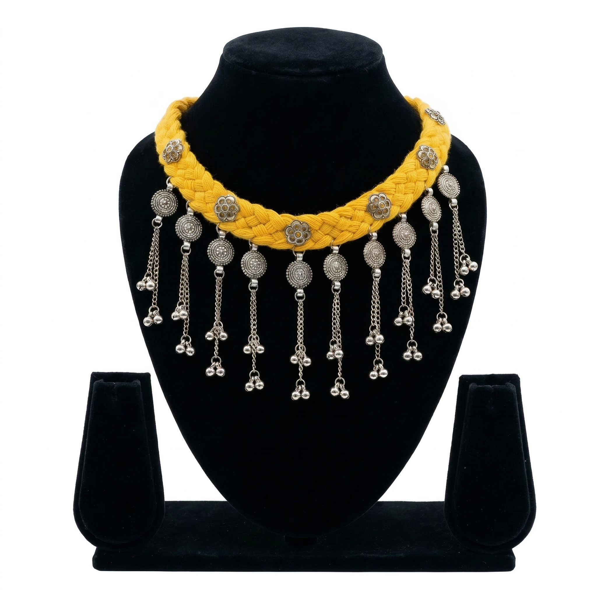 Yellow braided thread choker necklace on a black display stand featuring silver oxidised floral charms and metallic bead fringe.