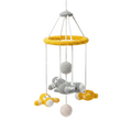 A handmade crocheted baby mobile featuring grey and yellow airplanes and white spheres hanging from a yellow hoop against a plain white background.