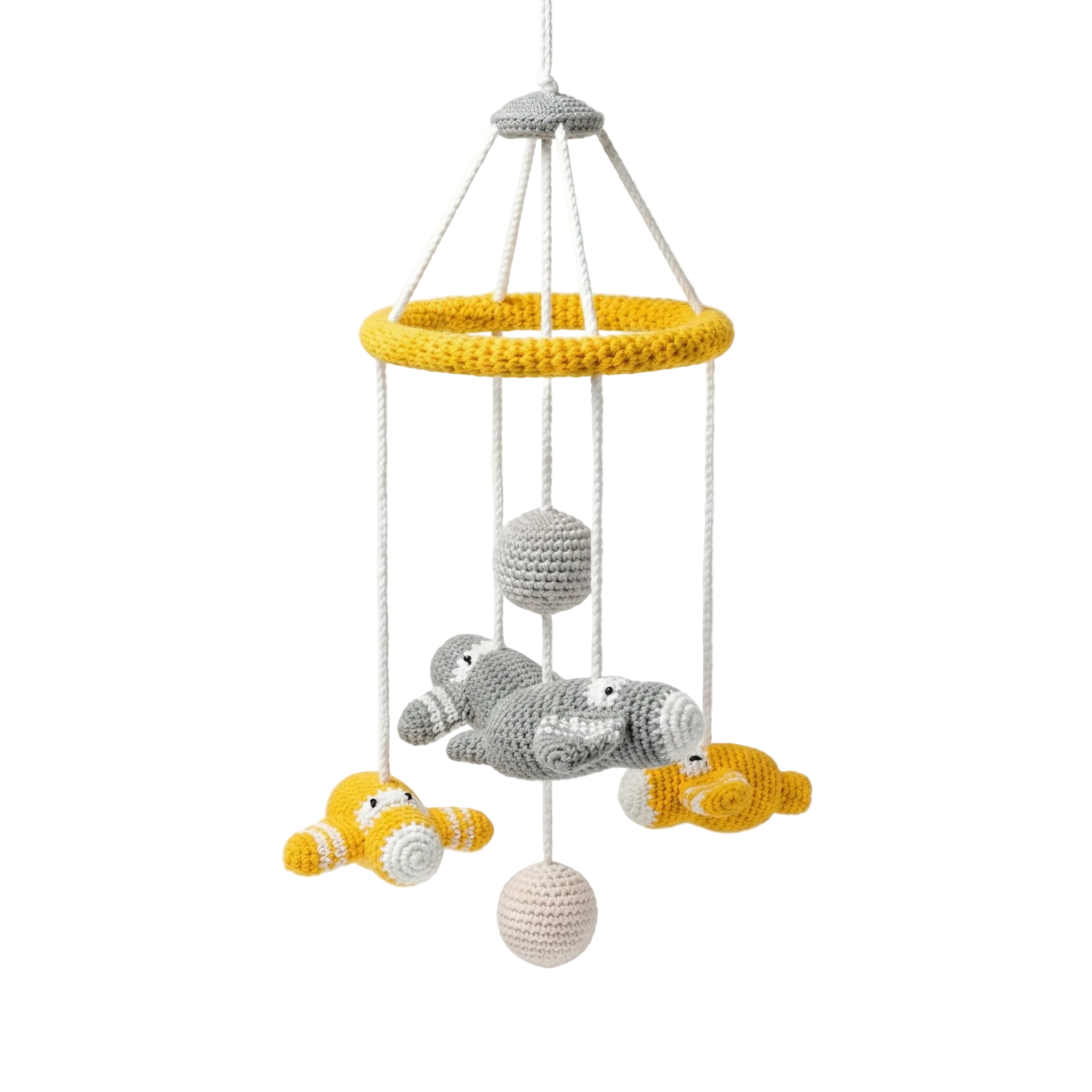 A handmade crocheted baby mobile featuring grey and yellow airplanes and white spheres hanging from a yellow hoop against a plain white background.