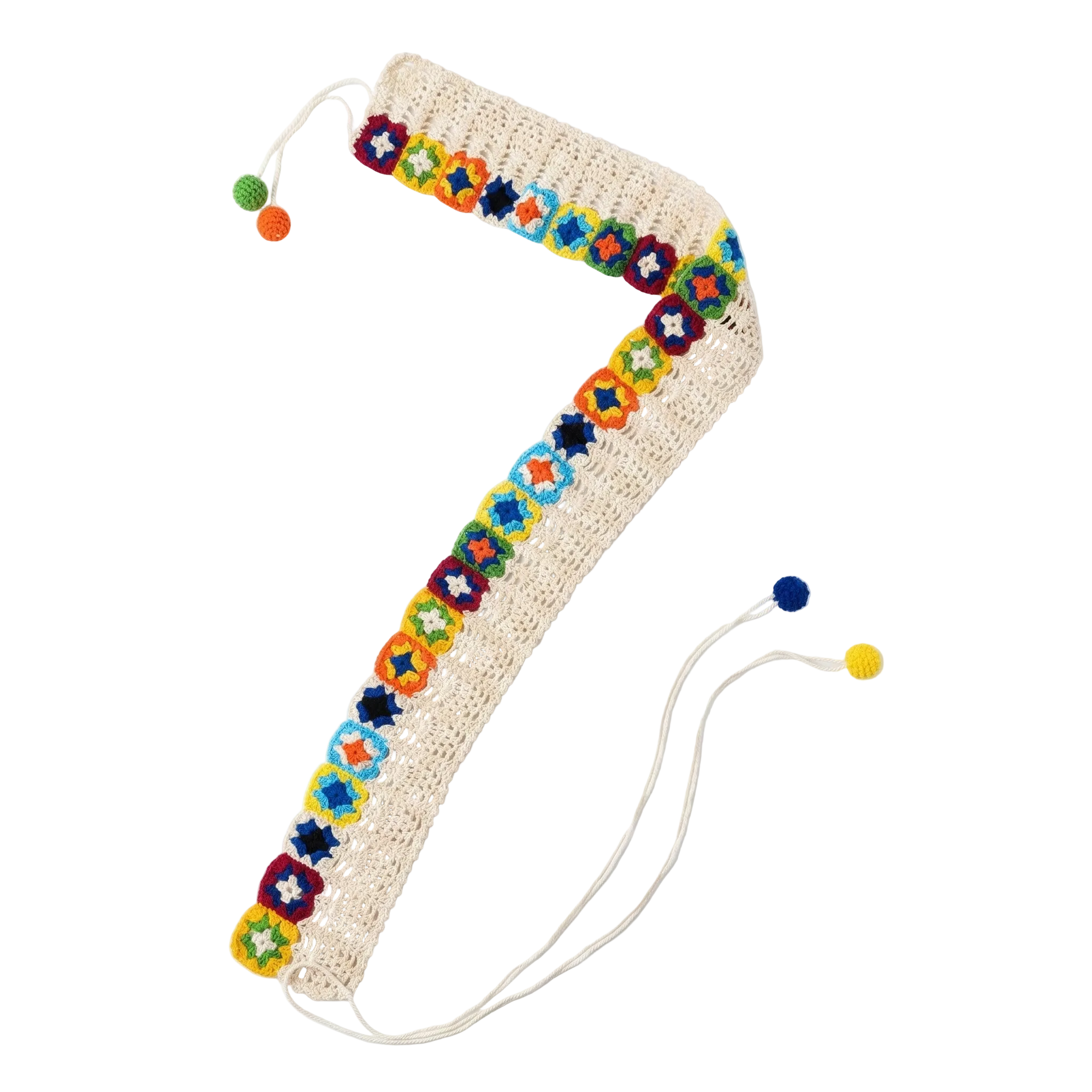 A cream-colored crochet belt featuring a row of vibrant, multi-colored granny squares and long tie-up tassels with pom-poms.