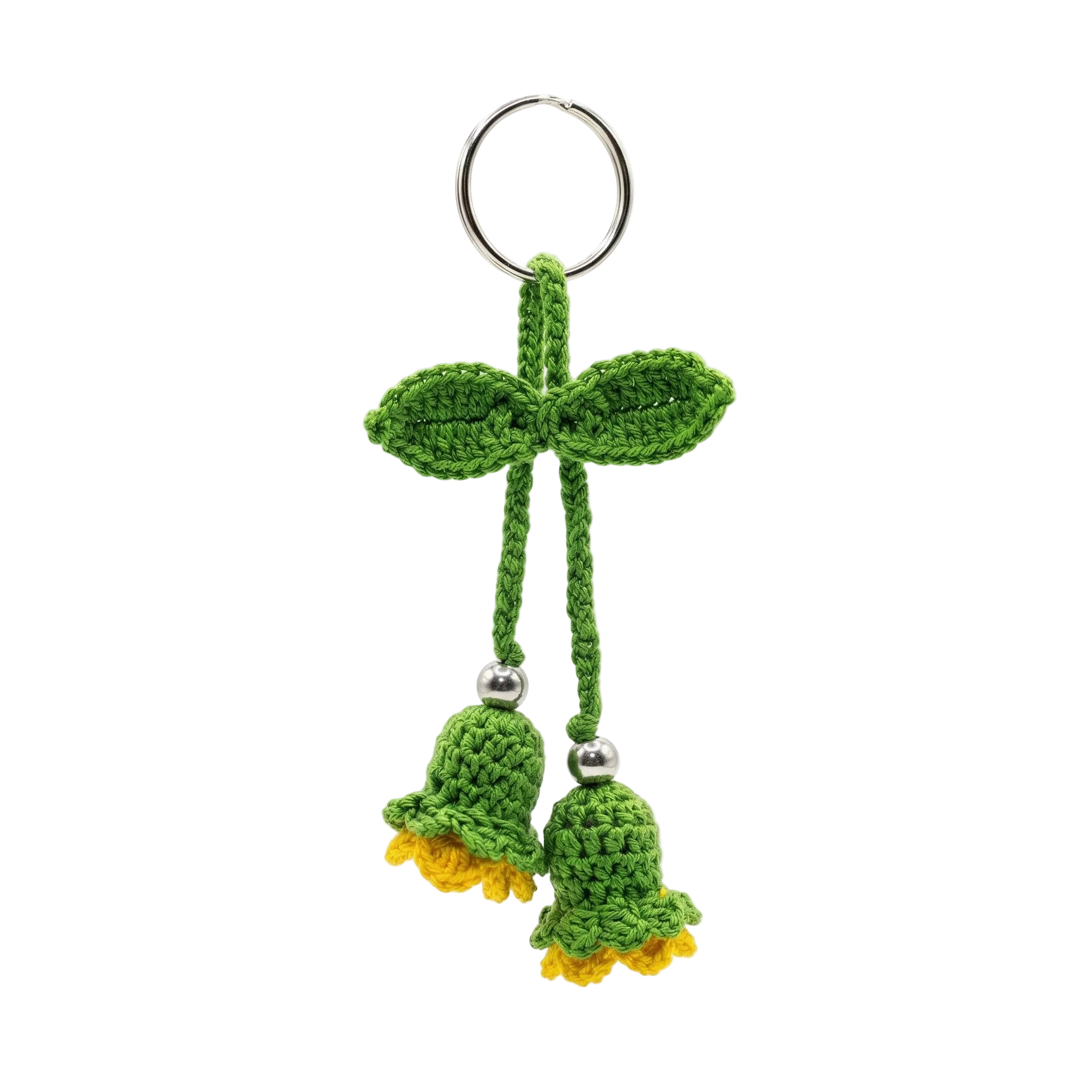 image of a handmade green and yellow crochet flower keychain with two bell-shaped blossoms and leaves on a plain white background.
