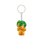 Add a touch of handmade charm to your collection with this adorable crochet pineapple keychain. Meticulously crafted using the amigurumi technique, this piece features vibrant yellow, orange, and green yarn that perfectly captures the tropical fruit's texture. It comes equipped with a sturdy metal ring and chain, making it the perfect decorative accessory for your keys, backpack, or handbag.
