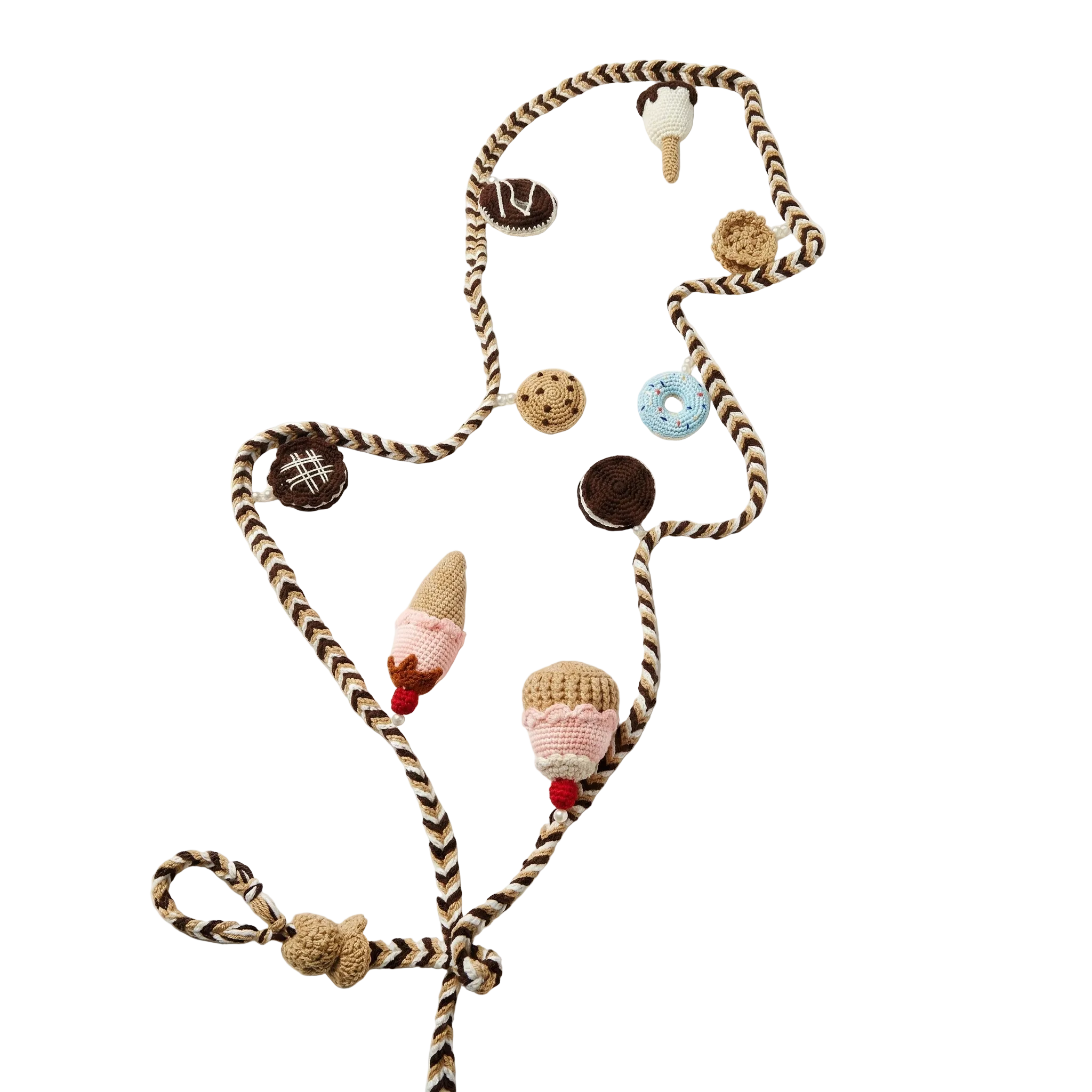 A braided brown and white cord garland featuring various handmade crochet treats including ice cream cones, donuts, and chocolate cookies on a plain white background.