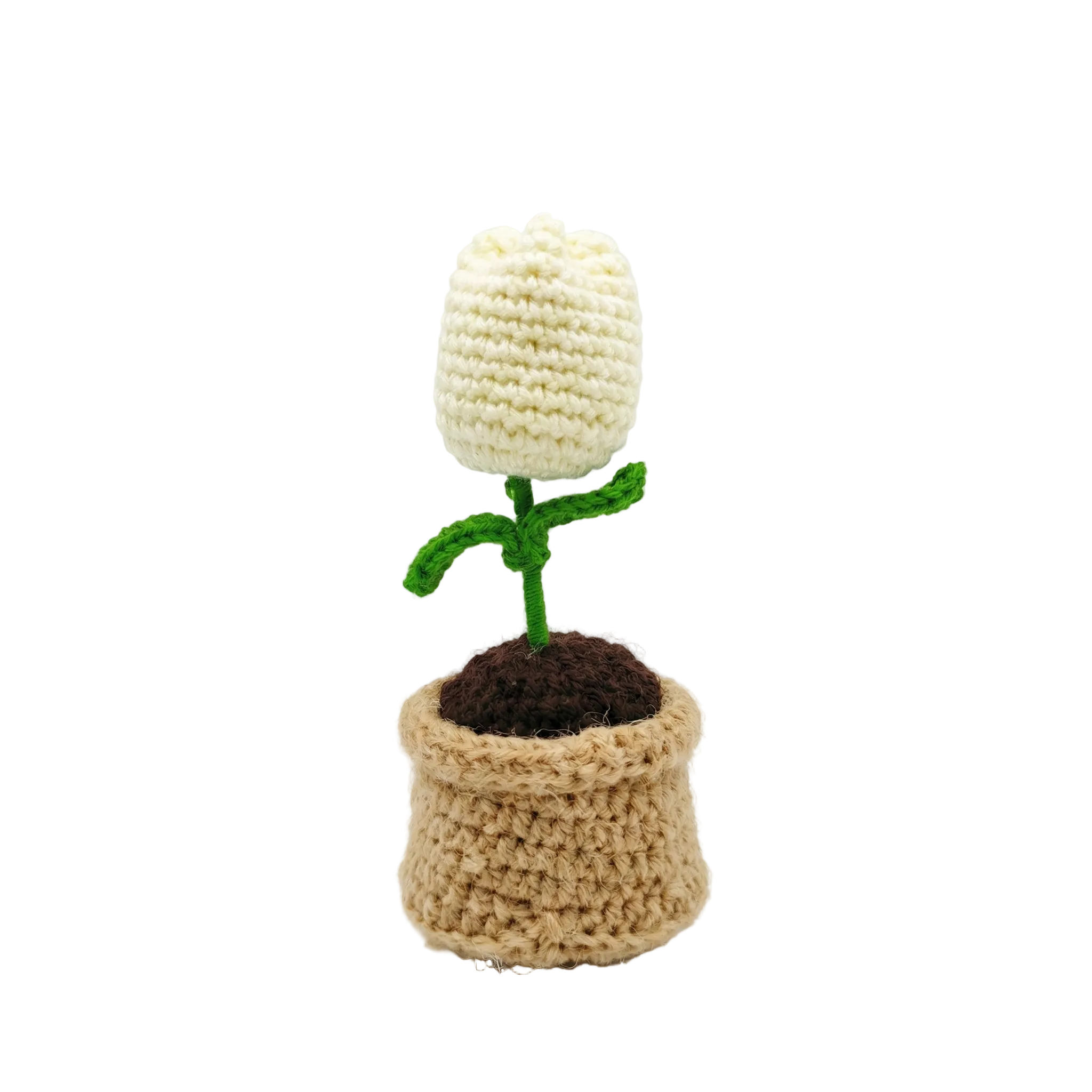 A small, handcrafted crochet white tulip flower with green leaves in a tan knitted pot, isolated on a white background.