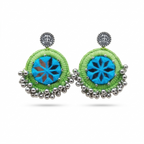 Handcrafted lime green silk thread earrings with blue star-patterned mirror work and silver bead hangings on a white background.
