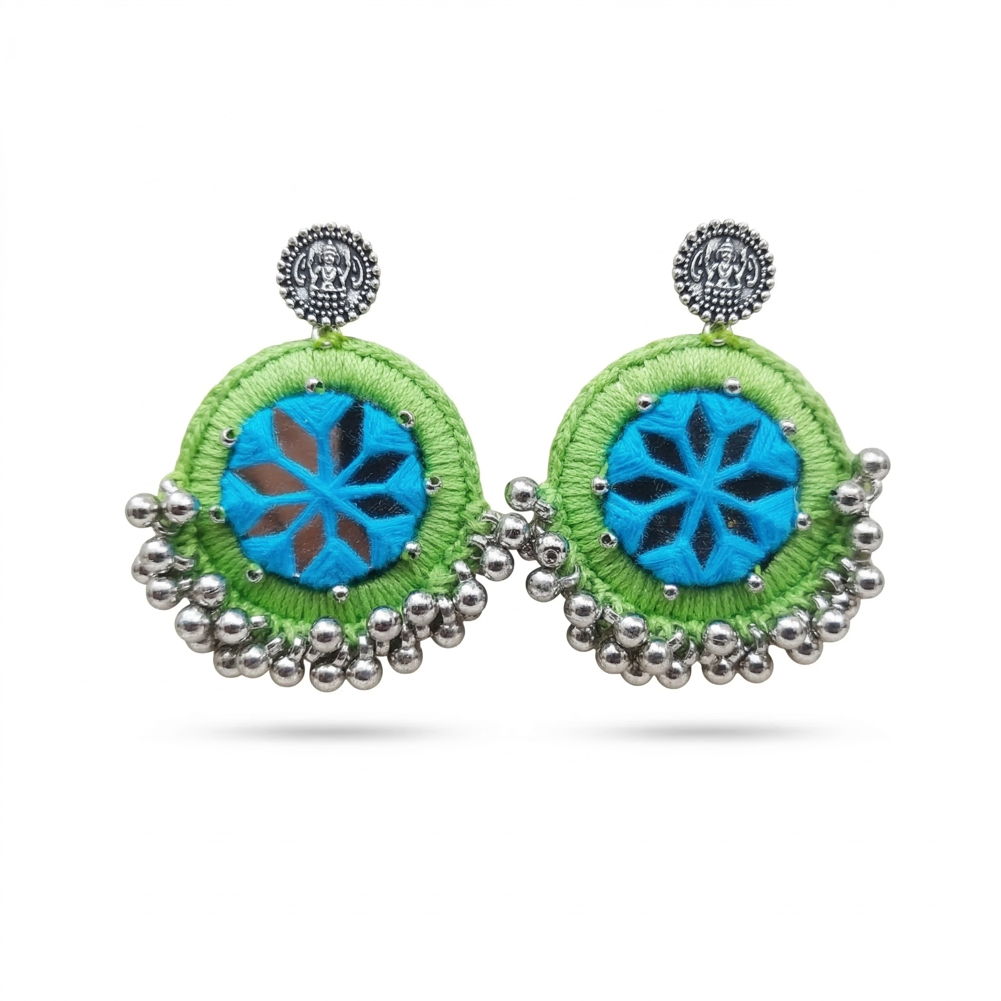 Handcrafted lime green silk thread earrings with blue star-patterned mirror work and silver bead hangings on a white background.