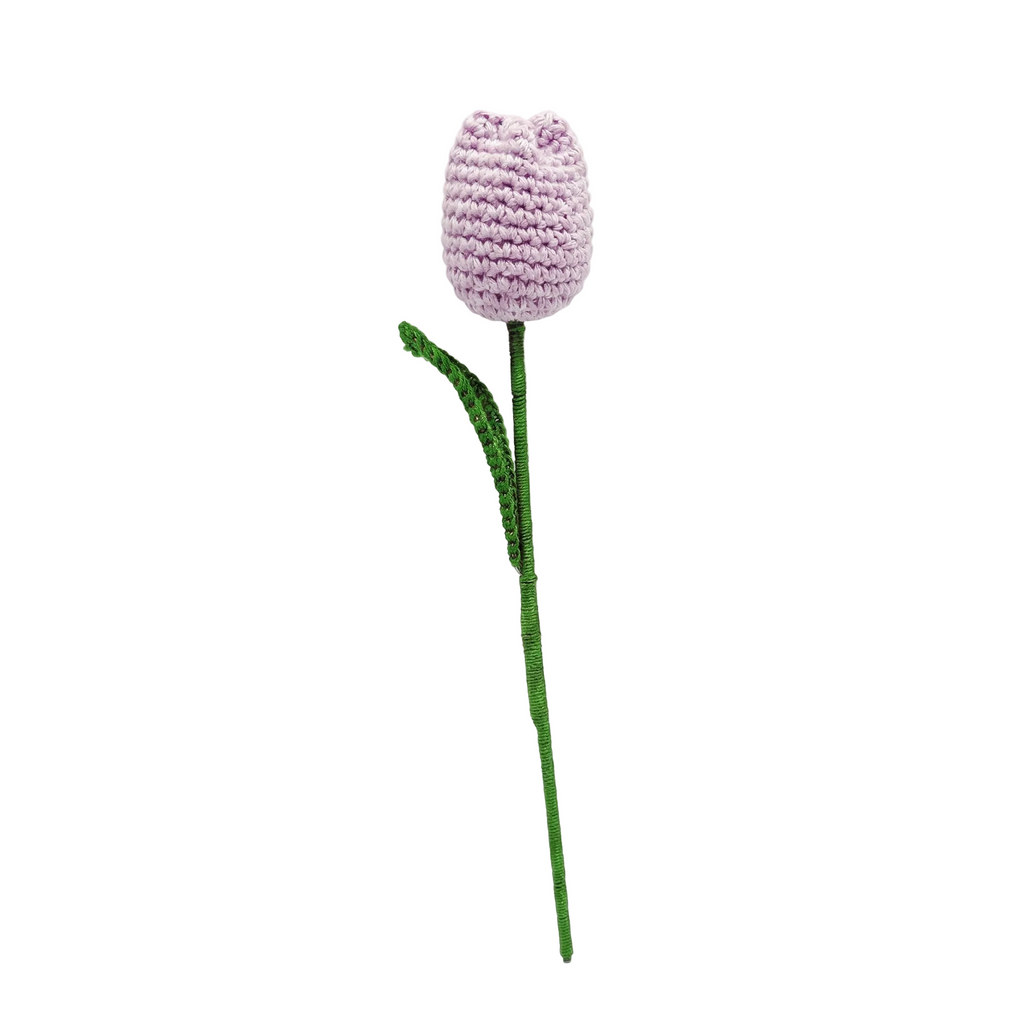 Single lavender purple crochet tulip flower with a green leaf and long stem on a white background.