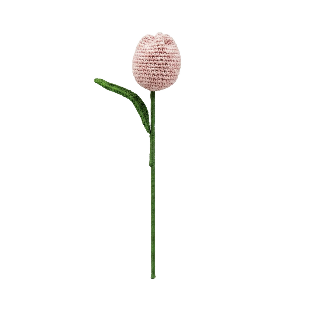 A single pink crocheted tulip flower with a green stem and leaf, isolated on a white background.