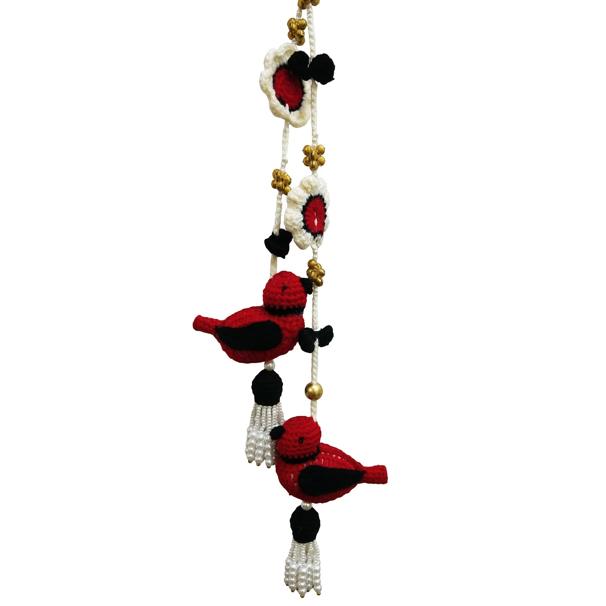 Handcrafted red and black crochet bird wall hanging with white flowers, gold beads, and pearl tassels on a white background.