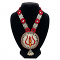 Handmade red and silver ethnic necklace with Trishul embroidery pendant and mirror work on a black jewelry bust, white background.