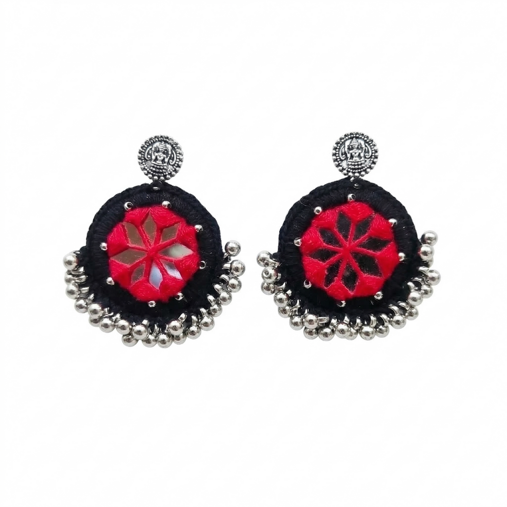 Pair of handcrafted black and red thread work earrings featuring center mirror inlay and oxidized silver bead droplets on a white background.