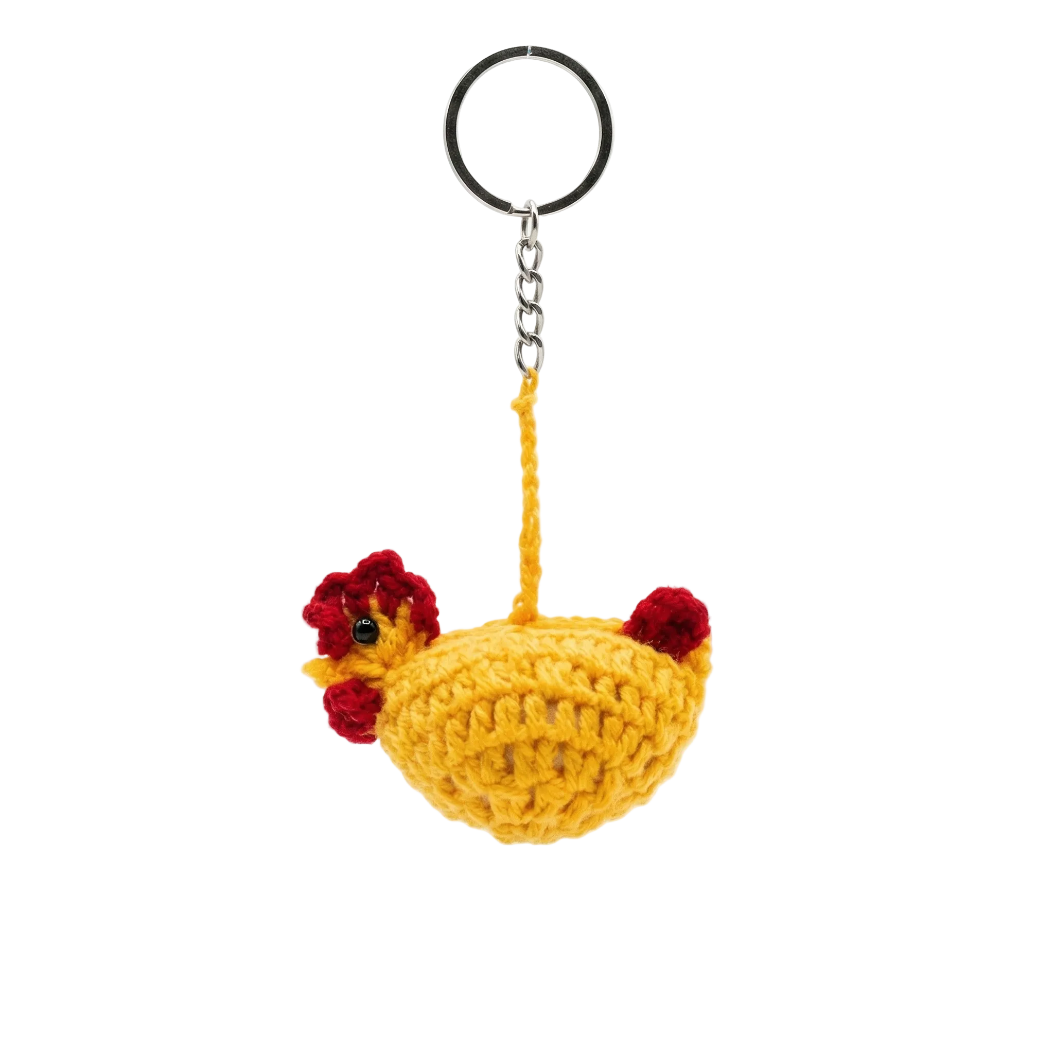 A handcrafted yellow crochet chicken keychain with red accents and a silver ring, isolated on a white background.