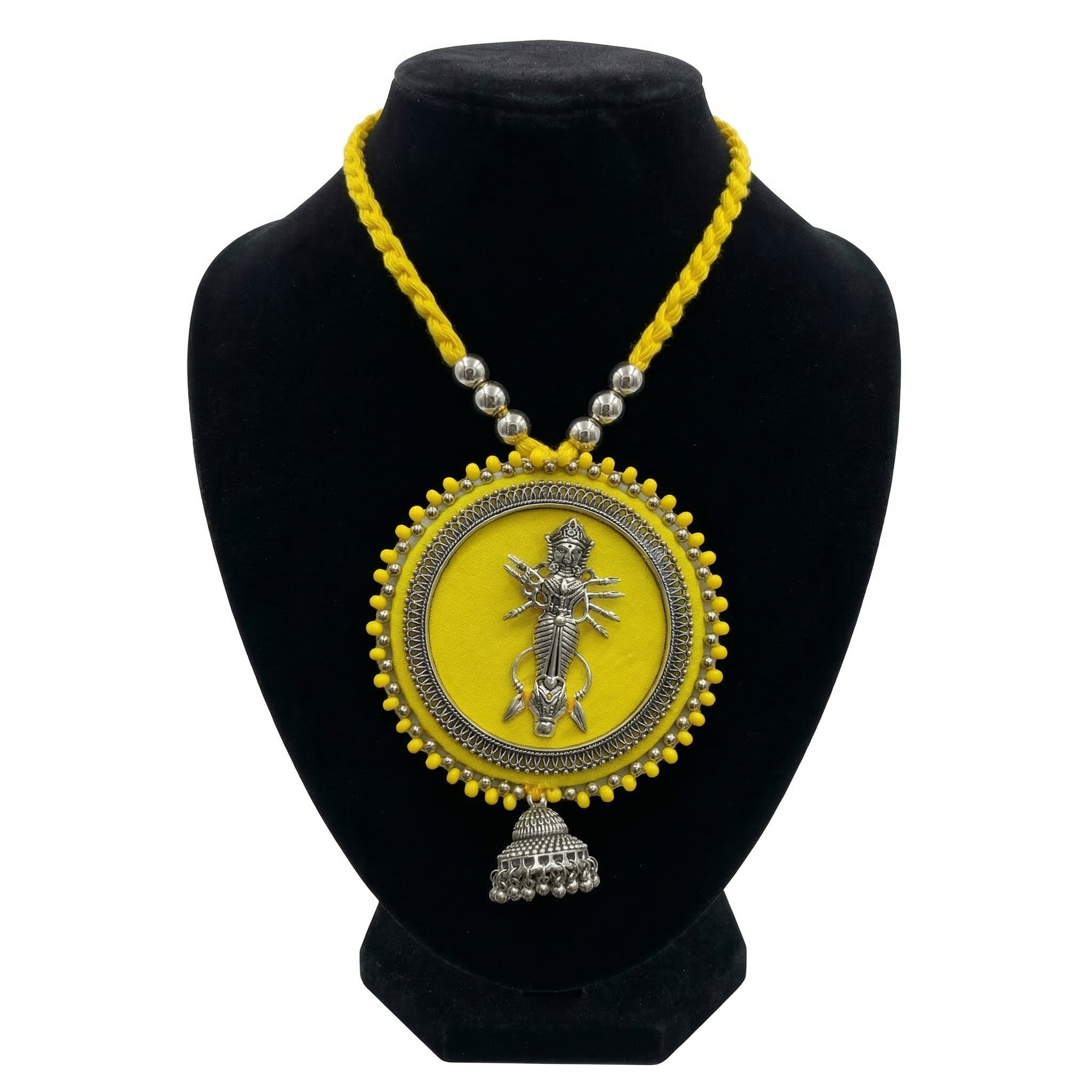 Yellow fabric necklace with silver oxidised Maa Durga pendant on black bust stand.