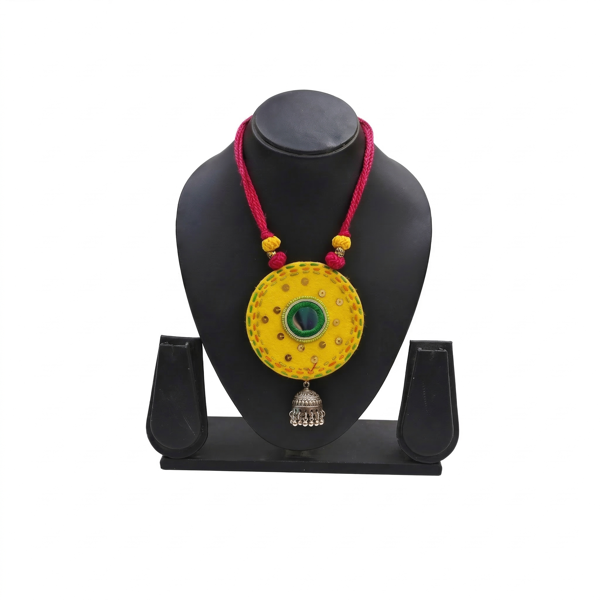 Handcrafted yellow fabric pendant necklace featuring green mirror work, pink thread cord, and a silver oxidised jhumka hanging.