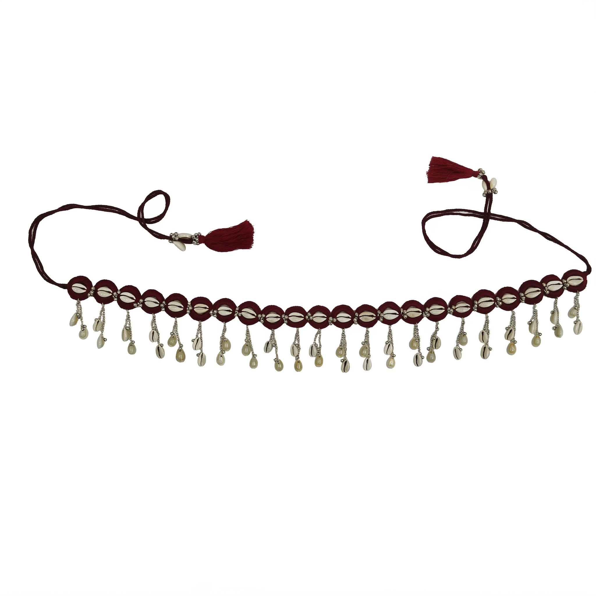 Maroon fabric waist belt adorned with white cowrie shells, silver beads, and dangling shell charms on a pure white background.