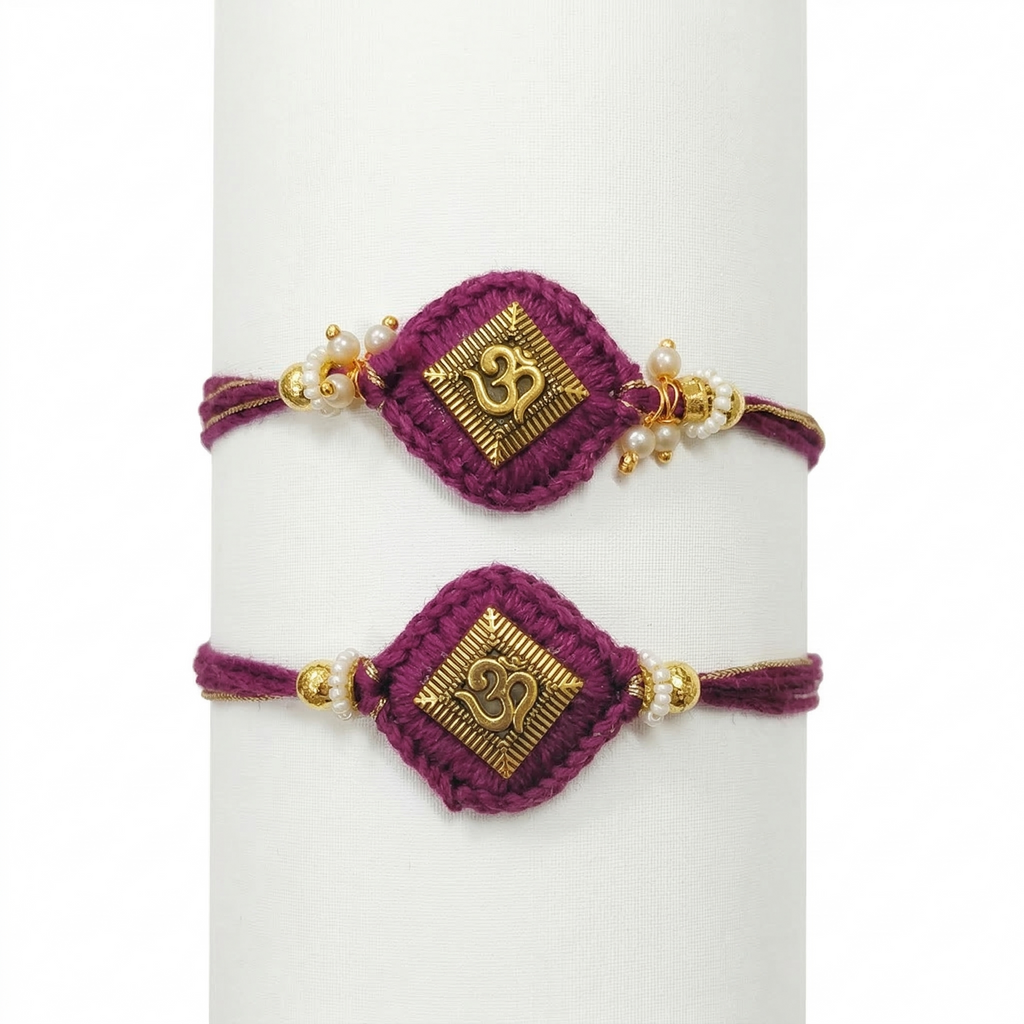 Two handcrafted purple thread Rakhis featuring gold-toned Om emblems on diamond-shaped crochet bases with pearl and gold bead embellishments.