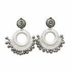 Pair of handmade white silk thread crochet hoop earrings featuring silver oxidized floral studs and dangling metallic ghungroo beads on a white background.