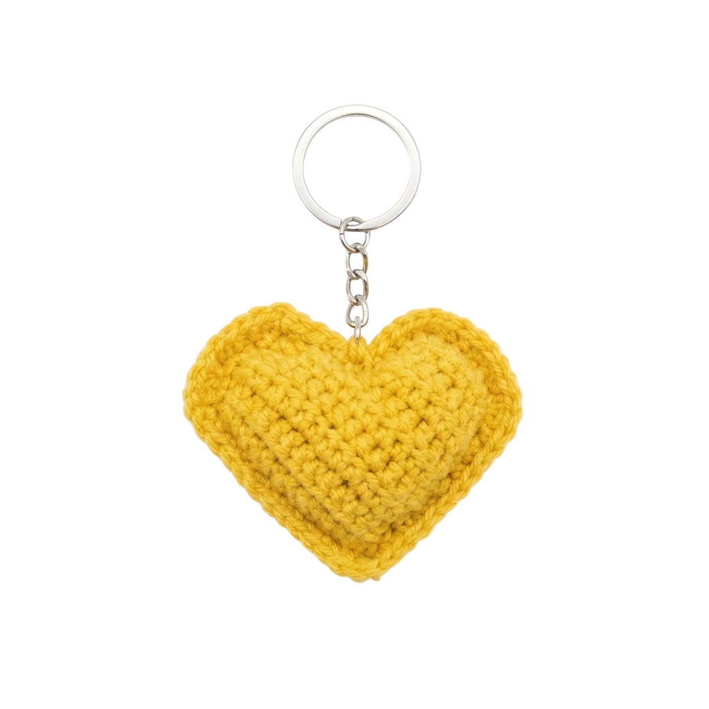 A bright yellow, hand-crocheted heart-shaped keychain with a silver metal ring and chain.